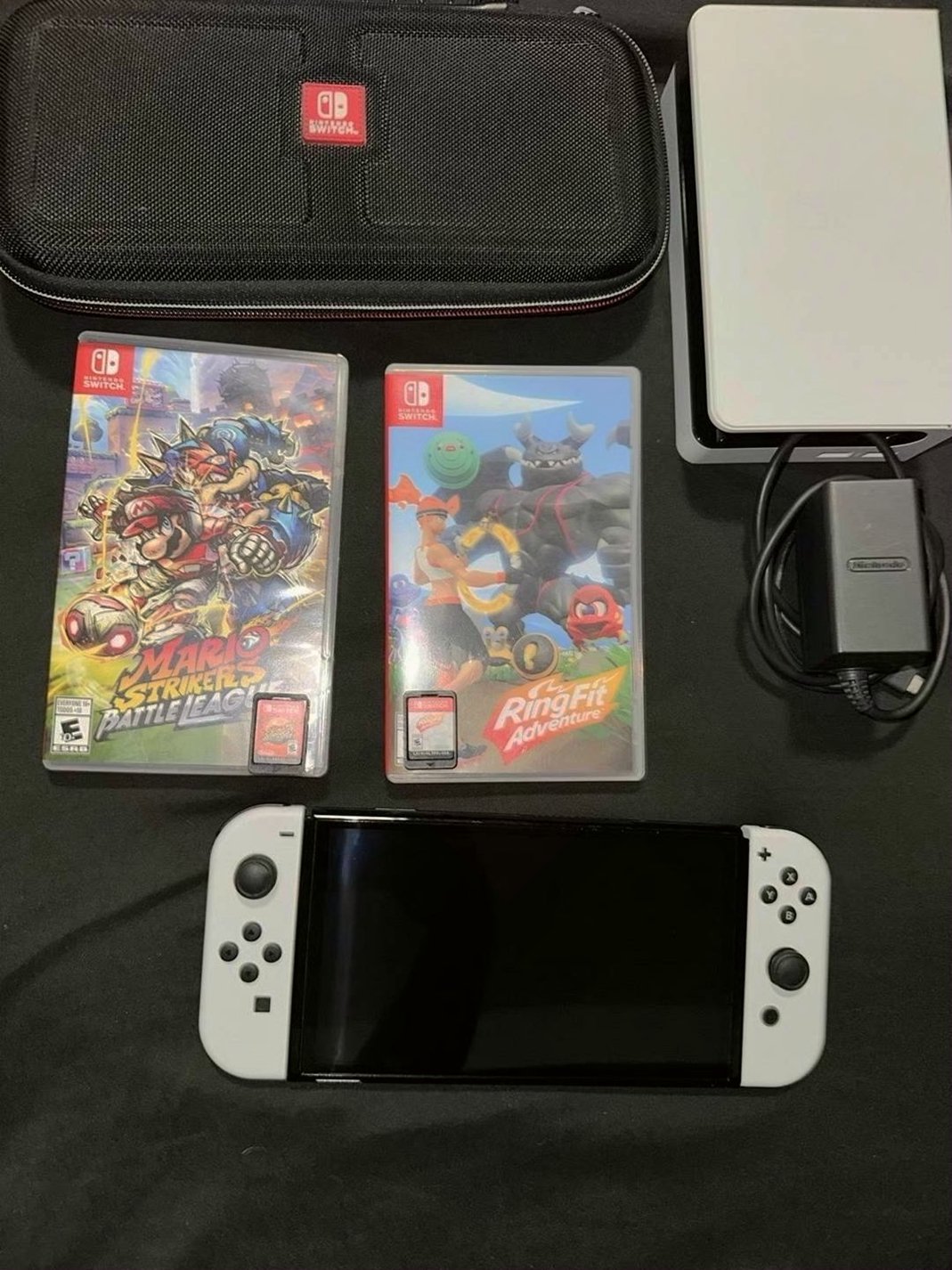 Nintendo Switch OLED White with Mario Strikers & Ring Fit Adventure - Used