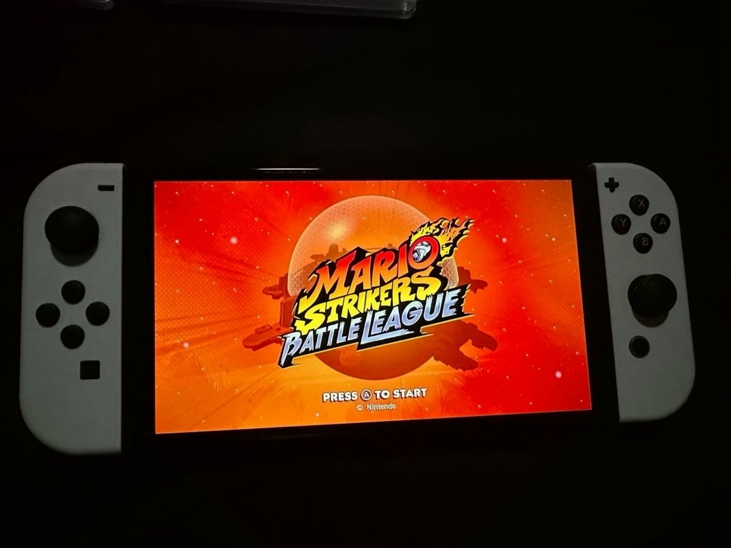 Nintendo Switch OLED White with Mario Strikers & Ring Fit Adventure - Used image 3