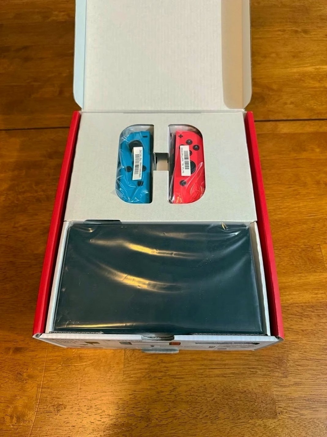 Nintendo Switch OLED 64GB Neon Red and Blue Unlocked - Used image 2